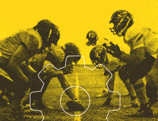 Football players facing off in yellow